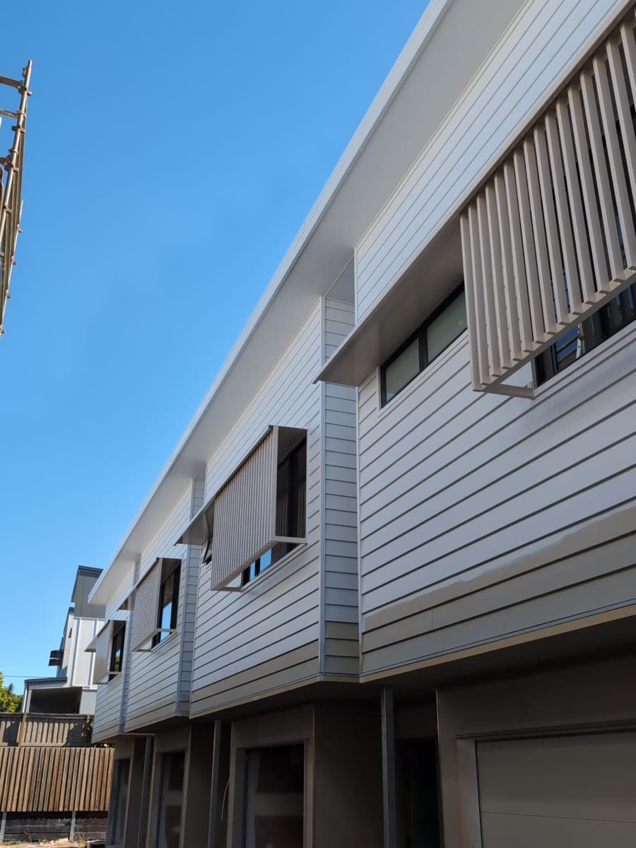 Townhouses with cladding and privacy screens by K&F Fabrications