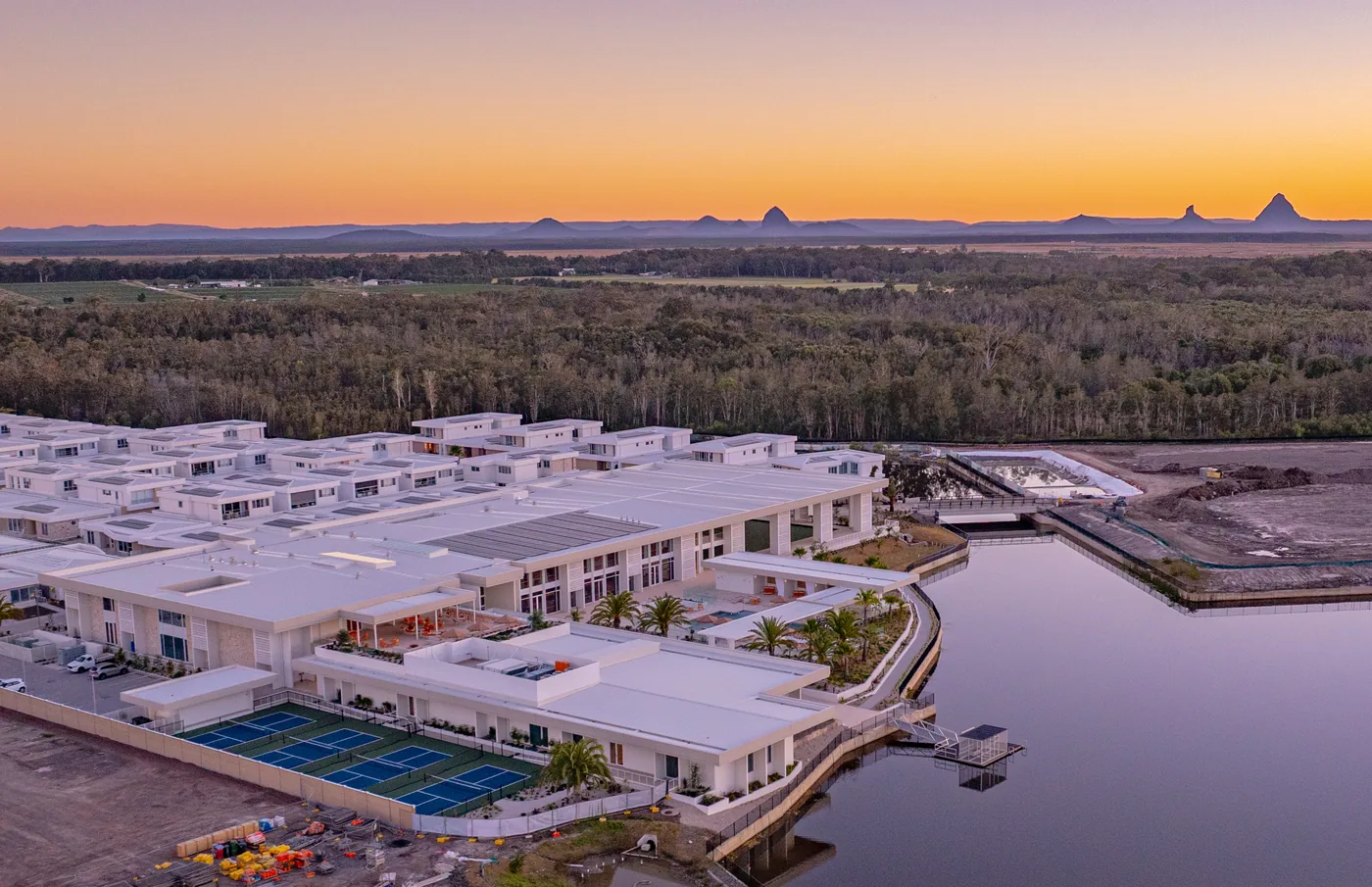 The resort at sunset with the Glass House Mountains on the horizon