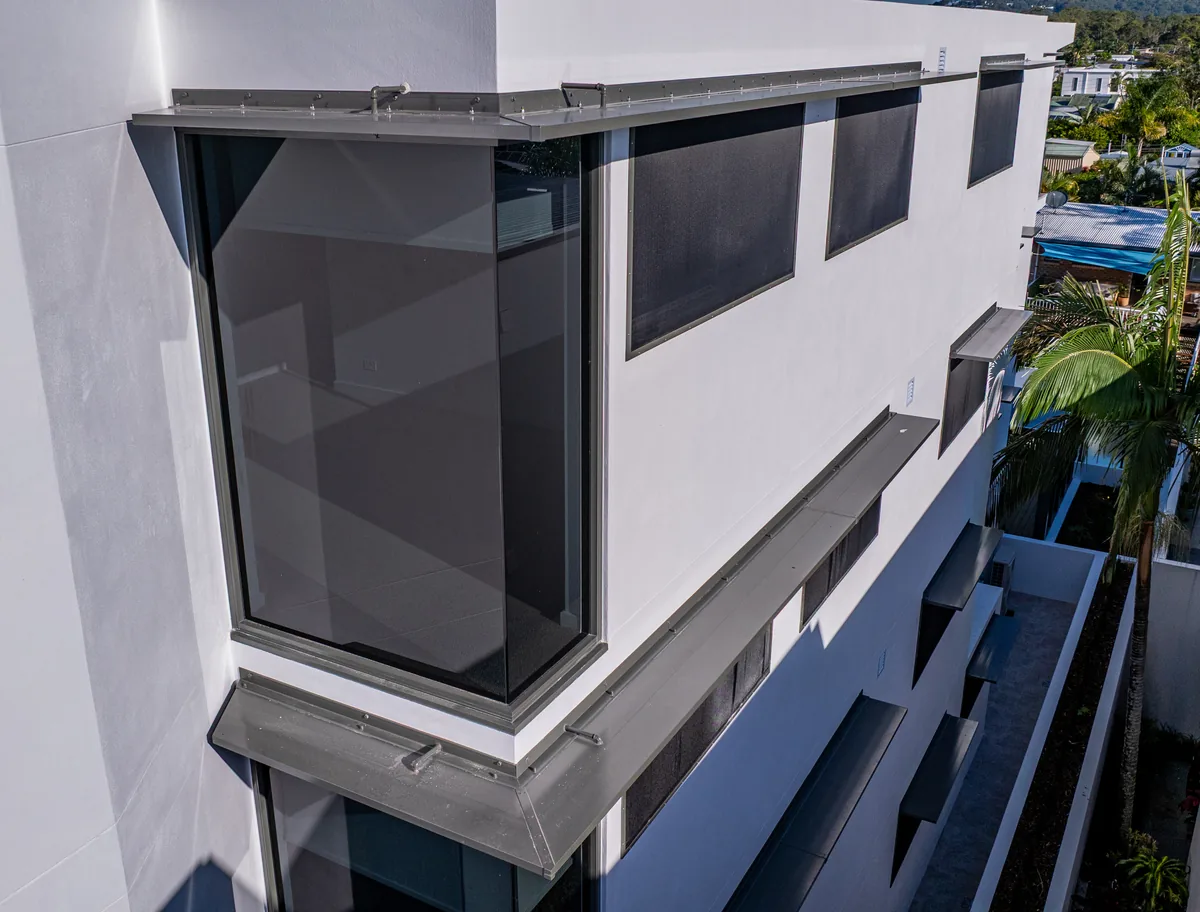 Dark privacy screening closing a corner balcony